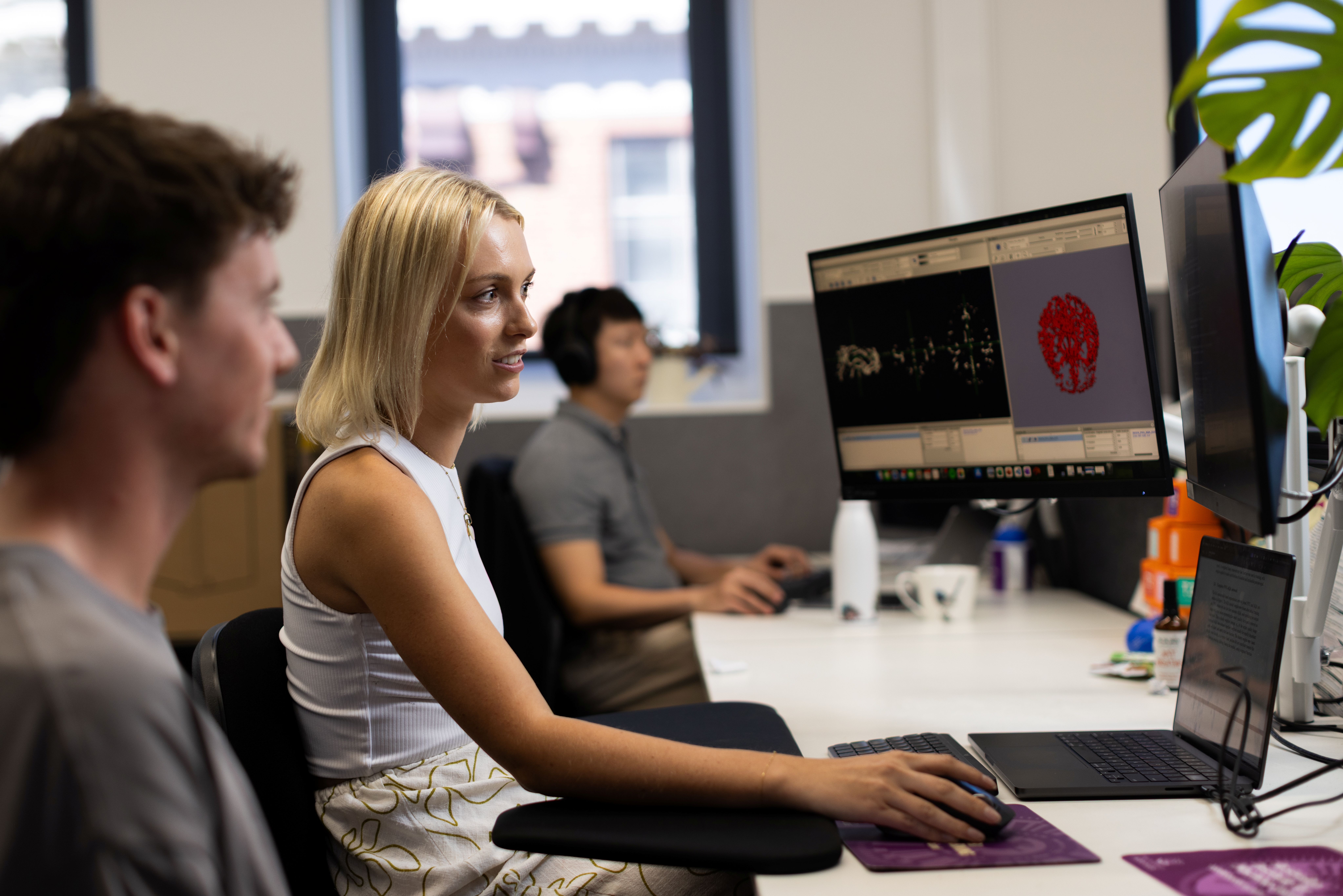 Woman conducting an evaluation on a desktop computer